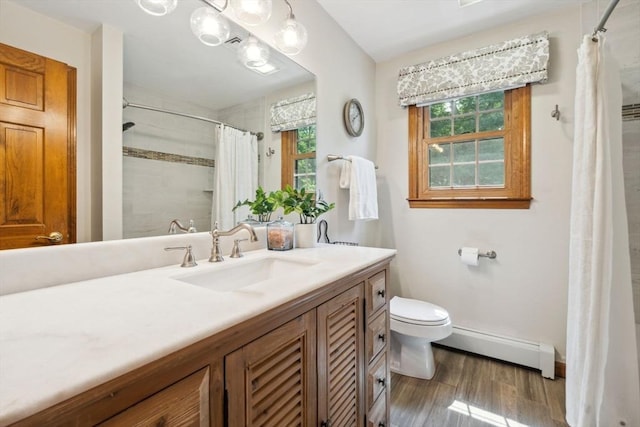 5 Red Tail Run, Canton, MA 02021 - full bath featuring a baseboard radiator, healthy amount of natural light, wood finished floors, and toilet
