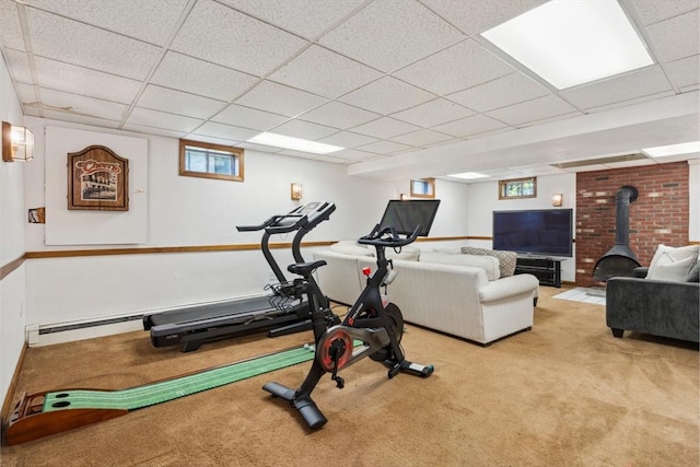 5 Red Tail Run, Canton, MA 02021 - exercise room featuring carpet floors, a paneled ceiling, plenty of natural light, and a wood stove