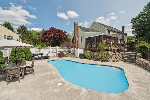 5 Red Tail Run, Canton, MA 02021 - view of swimming pool featuring a sunroom, a gate, a patio area, stairway, and a fenced backyard