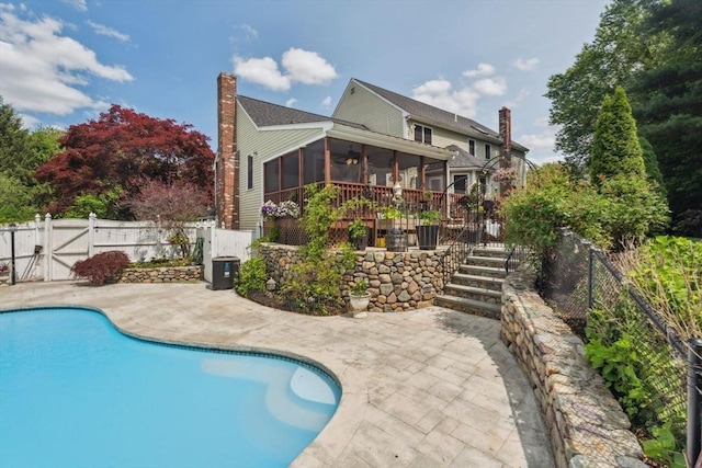 5 Red Tail Run, Canton, MA 02021 - view of swimming pool with a gate, a sunroom, a patio area, and a fenced backyard