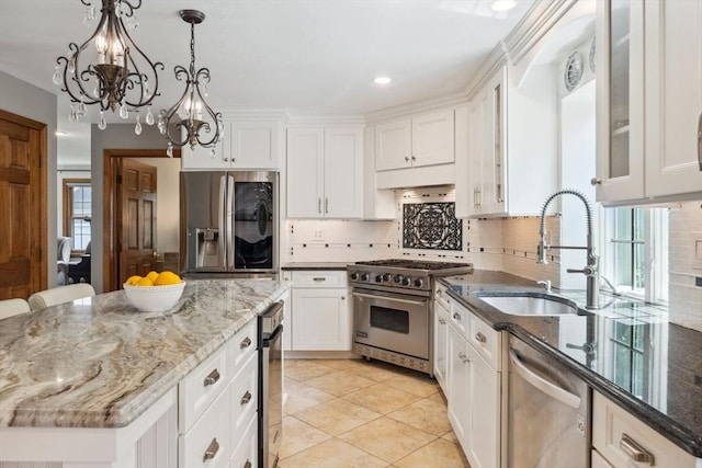 5 Red Tail Run, Canton, MA 02021 - kitchen featuring stainless steel appliances, a sink, a chandelier, white cabinets, and tasteful backsplash