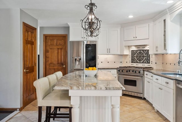 5 Red Tail Run, Canton, MA 02021 - kitchen with stainless steel appliances, a sink, a chandelier, light tile patterned floors, and recessed lighting