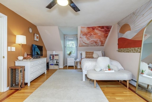 50 Kienia Rd, Hudson, NH 03051 - bedroom featuring light wood-style flooring, vaulted ceiling, ceiling fan, and a baseboard heating unit