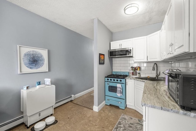 151 W 6th St Unit 1, Boston, MA 02127 - kitchen featuring gas range, stainless steel microwave, a sink, a baseboard heating unit, and a textured ceiling