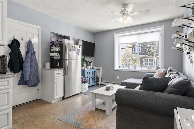 151 W 6th St Unit 1, Boston, MA 02127 - living room featuring a baseboard radiator, a ceiling fan, and a textured ceiling
