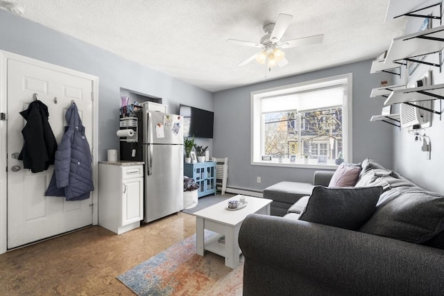 151 W 6th St Unit 1, Boston, MA 02127 - living room featuring a baseboard heating unit, ceiling fan, and a textured ceiling