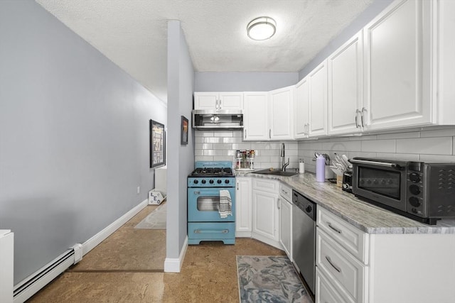 151 W 6th St Unit 1, Boston, MA 02127 - kitchen featuring appliances with stainless steel finishes, a baseboard radiator, a sink, white cabinetry, and a textured ceiling