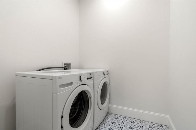 laundry area with washer and clothes dryer