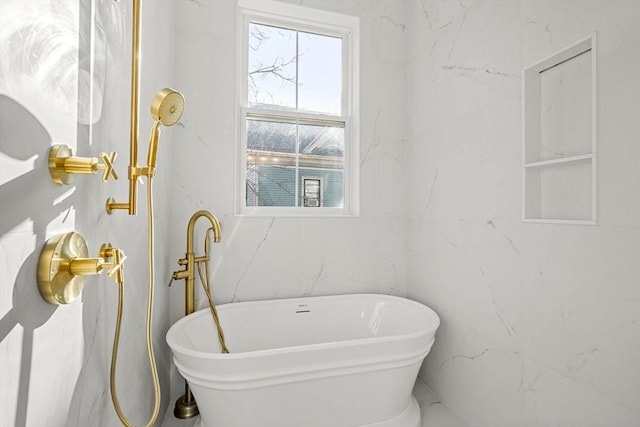 bathroom featuring a tub to relax in