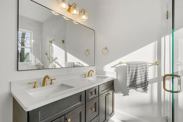 bathroom with a shower with door and vanity