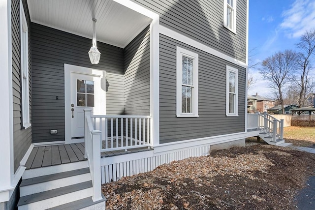 view of exterior entry featuring a porch