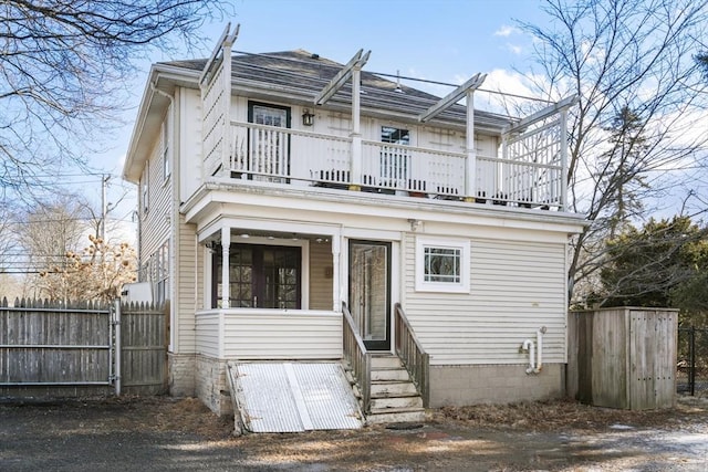 view of front of house with a balcony