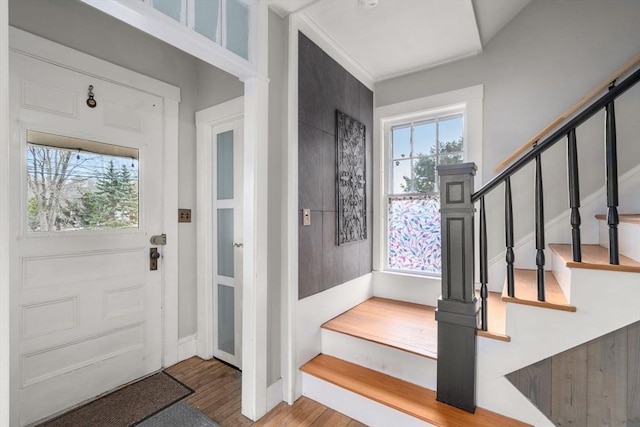 entryway with hardwood / wood-style floors