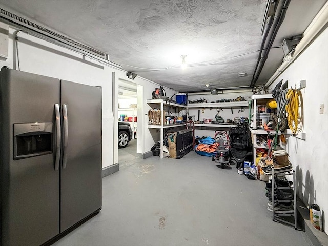 1 Fieldstone Way, Hopedale, MA 01747 - below grade area with stainless steel fridge with ice dispenser, a garage, and a workshop area
