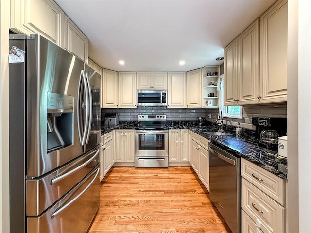 1 Fieldstone Way, Hopedale, MA 01747 - kitchen with appliances with stainless steel finishes, open shelves, a sink, light wood-type flooring, and decorative backsplash