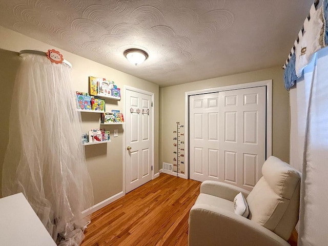 1 Fieldstone Way, Hopedale, MA 01747 - living area with light wood-style flooring and baseboards