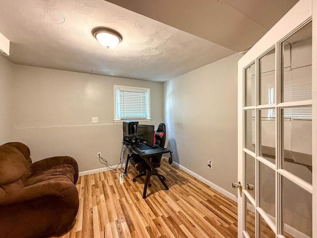 1 Fieldstone Way, Hopedale, MA 01747 - home office featuring baseboards, light wood-type flooring, and a textured ceiling
