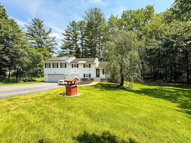 1 Fieldstone Way, Hopedale, MA 01747 - view of front of home with driveway, an attached garage, and a front lawn