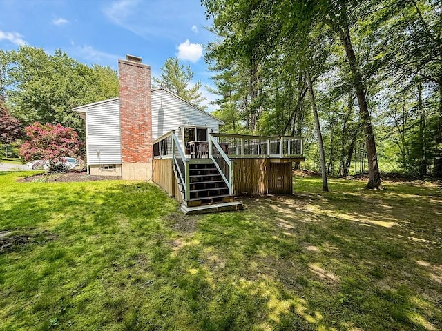 1 Fieldstone Way, Hopedale, MA 01747 - rear view of property featuring a wooden deck, stairway, a chimney, and a yard