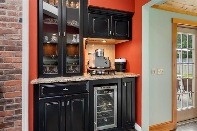 7 Scenic Dr, Wilbraham, MA 01095 - indoor dry bar featuring wine cooler, tasteful backsplash, and wood finished floors