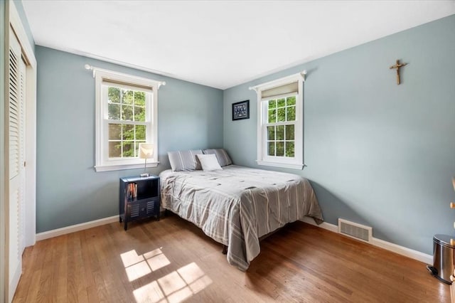 7 Scenic Dr, Wilbraham, MA 01095 - bedroom featuring wood finished floors and multiple windows
