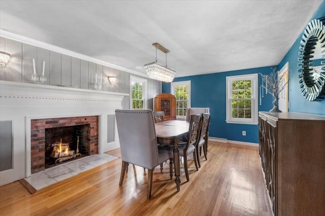 7 Scenic Dr, Wilbraham, MA 01095 - dining area featuring light wood-style floors and a brick fireplace