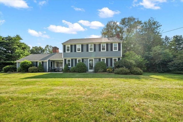 7 Scenic Dr, Wilbraham, MA 01095 - colonial house featuring a chimney and a front lawn