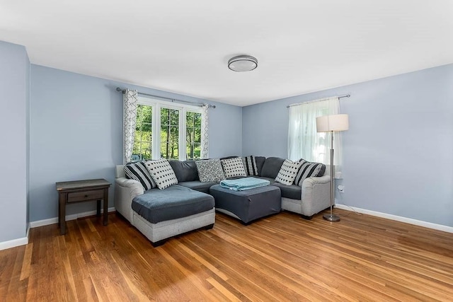 66 Barnum St, Taunton, MA 02780 - living room featuring light wood-style floors and baseboards