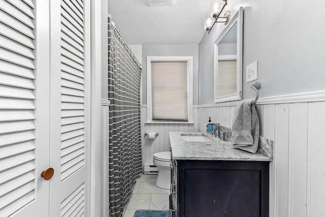 66 Barnum St, Taunton, MA 02780 - full bath with marble look tile flooring, a baseboard radiator, vanity, a wainscoted wall, and a shower with curtain