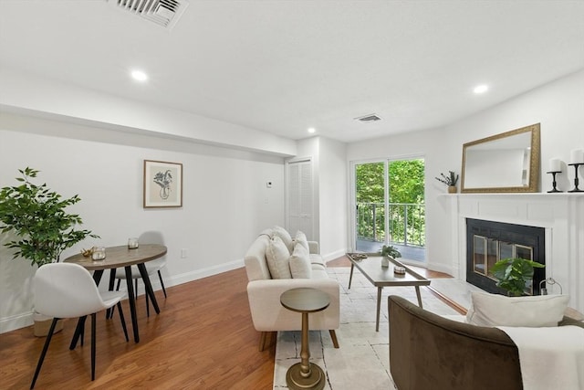 76 Ship Ave Unit 7, Medford, MA 02155 - living room with a fireplace, recessed lighting, and light wood-type flooring