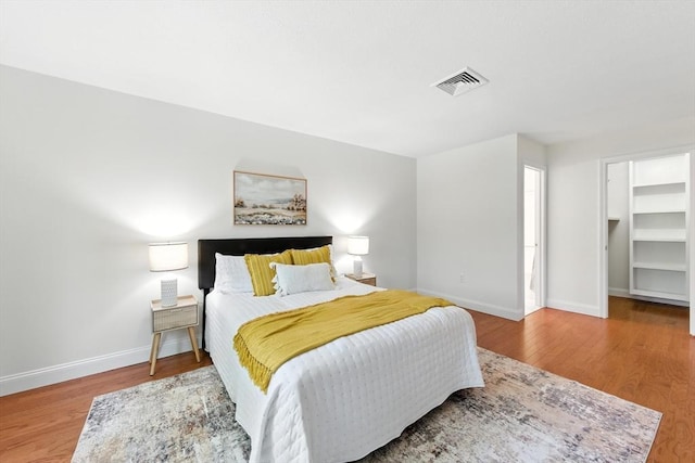 76 Ship Ave Unit 7, Medford, MA 02155 - bedroom with wood finished floors and a walk in closet