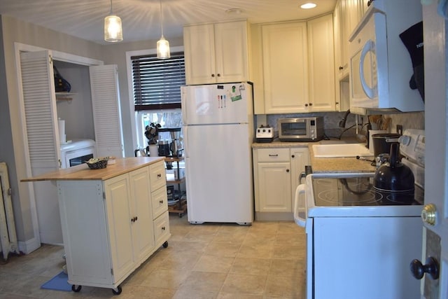 kitchen featuring recessed lighting, white appliances, white cabinets, decorative backsplash, and hanging light fixtures
