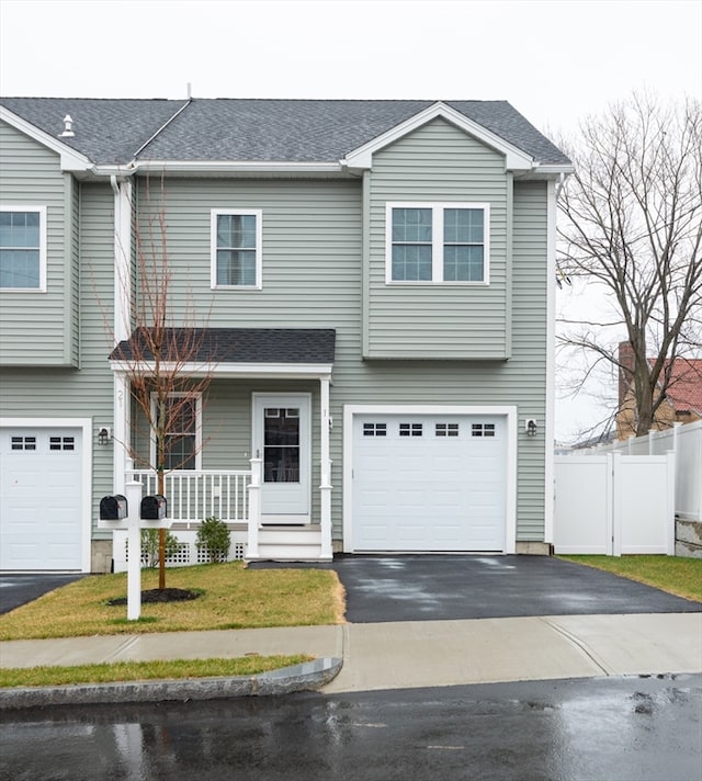 view of front of property with a garage and covered porch