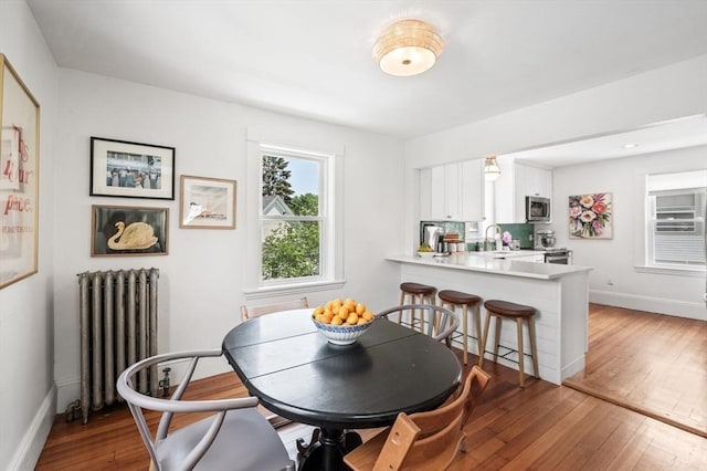 16 Desmond Ave, Manchester, MA 01944 - dining room with radiator heating unit and wood-type flooring