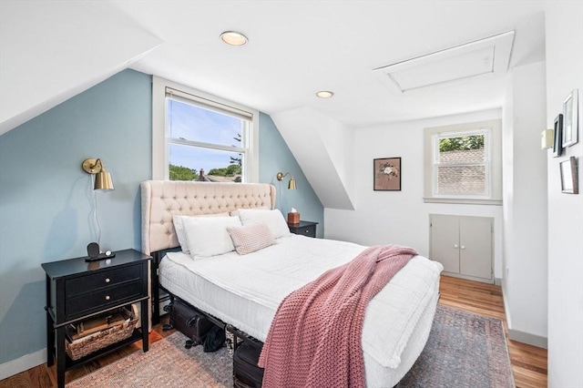 16 Desmond Ave, Manchester, MA 01944 - bedroom with attic access, wood finished floors, vaulted ceiling, and recessed lighting