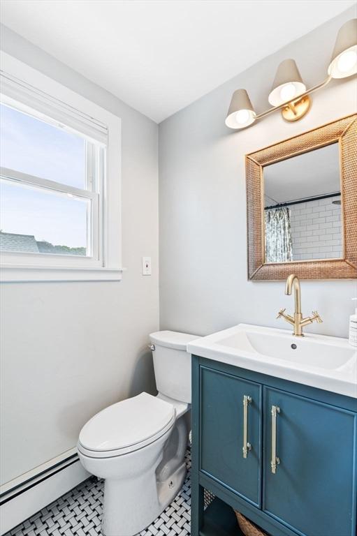 16 Desmond Ave, Manchester, MA 01944 - full bathroom with baseboard heating, vanity, and tile patterned floors