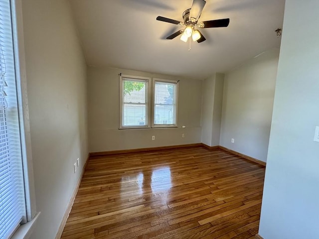 65 Cedar St, Weymouth, MA 02189 - spare room with lofted ceiling, hardwood / wood-style flooring, a ceiling fan, and baseboards