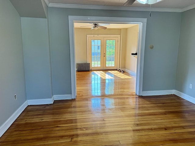 65 Cedar St, Weymouth, MA 02189 - unfurnished room with radiator, ceiling fan, wood-type flooring, baseboards, and crown molding