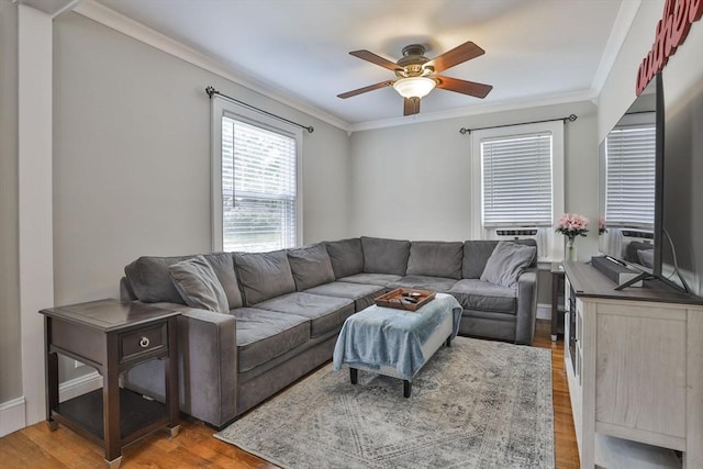 10 Hemenway St, Methuen, MA 01844 - living area featuring a ceiling fan, crown molding, and light wood-type flooring