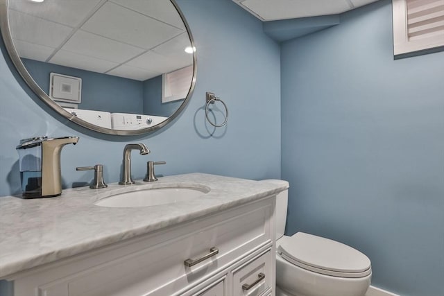 10 Hemenway St, Methuen, MA 01844 - half bathroom featuring vanity, toilet, and a drop ceiling