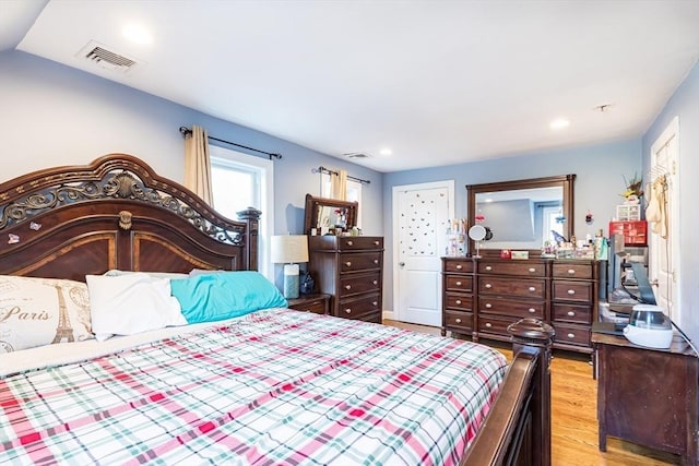 bedroom with light hardwood / wood-style flooring