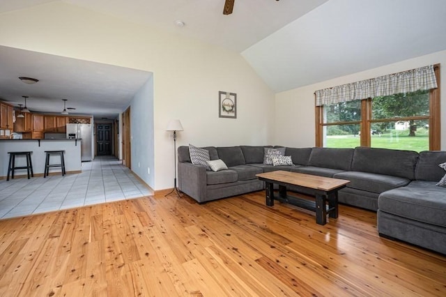10 Tobin Dr, Dudley, MA 01571 - living room featuring light wood-type flooring, vaulted ceiling, and ceiling fan