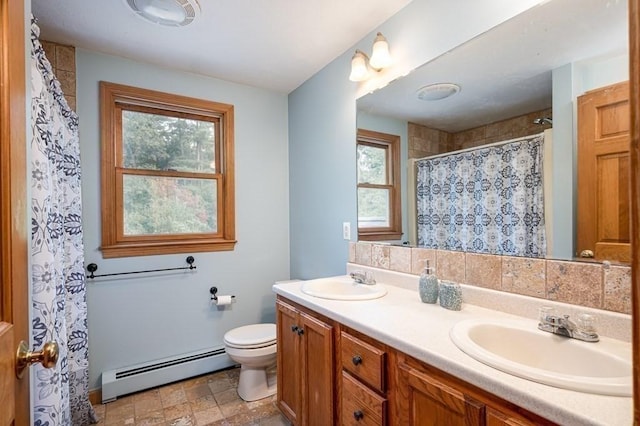 10 Tobin Dr, Dudley, MA 01571 - full bathroom with a baseboard heating unit, double vanity, a shower with shower curtain, and stone finish flooring