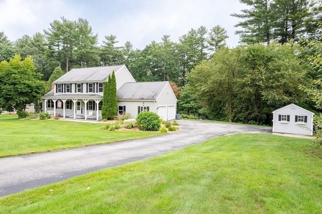 10 Tobin Dr, Dudley, MA 01571 - colonial home with a porch, a garage, a front yard, and driveway