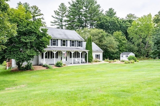 10 Tobin Dr, Dudley, MA 01571 - rear view of property featuring covered porch, a lawn, and a storage shed
