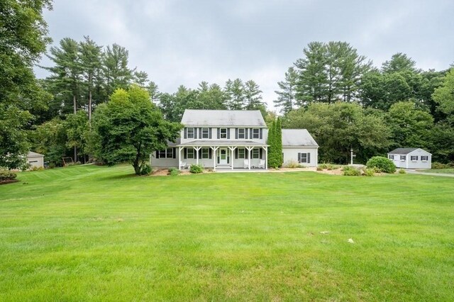 10 Tobin Dr, Dudley, MA 01571 - back of property featuring a porch and a lawn