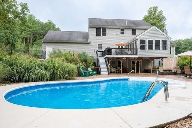 10 Tobin Dr, Dudley, MA 01571 - view of pool featuring stairway, a wooden deck, and a patio area