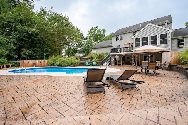 10 Tobin Dr, Dudley, MA 01571 - view of swimming pool with stairway, a deck, a patio, and outdoor dining space