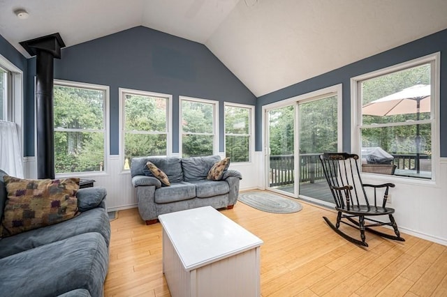 10 Tobin Dr, Dudley, MA 01571 - living room with lofted ceiling, light wood-style floors, and a wainscoted wall