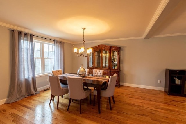 225 Salem Rd, Dracut, MA 01826 - dining space with a chandelier, light wood-style floors, ornamental molding, and baseboards